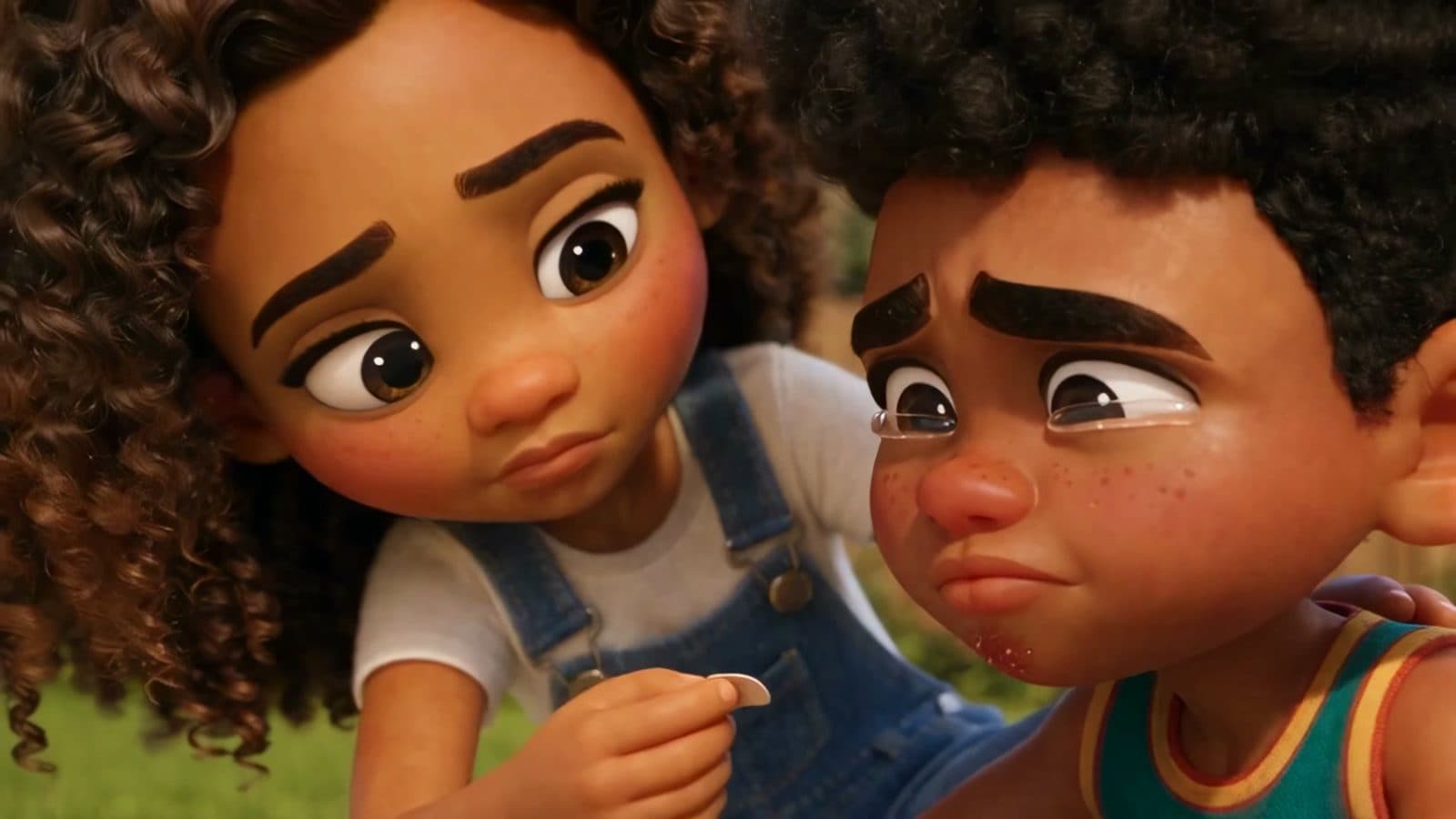 One of Micah's older sisters comforts a teary Micah after he falls.